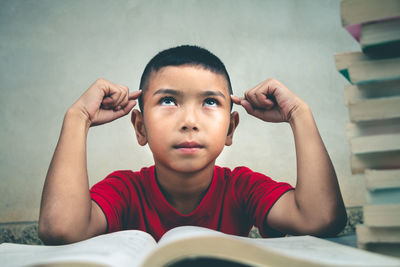 Portrait of boy holding book