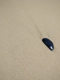 High angle view of shoes on sand