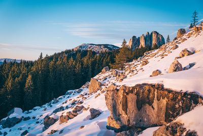 Scenic view of snow covered mountains against sky