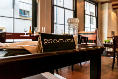 Empty chairs and tables in restaurant