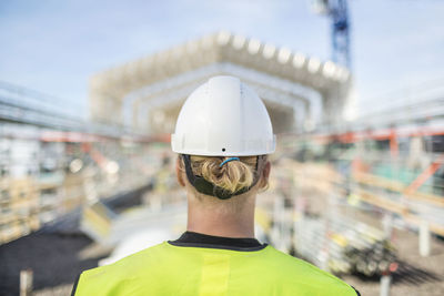 Rear view of male construction worker at site