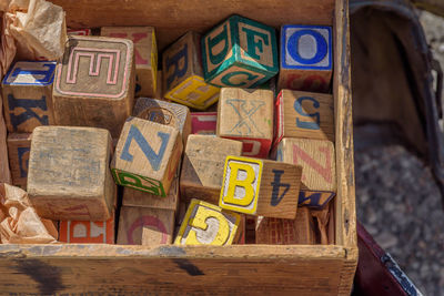 Close-up of multi colored text on wood