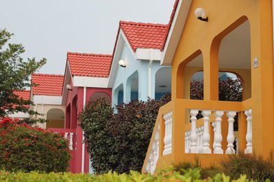 House amidst buildings against sky