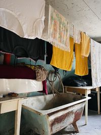 Clothes hanging to dry in old attic