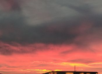 Low angle view of dramatic sky during sunset