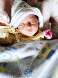 Cute baby sleeping on bed