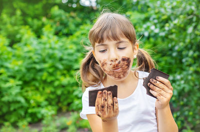 Young woman drinking milk in park