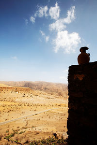 Landscape seen through old ruins against sky