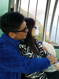 Close-up of young woman wearing sunglasses