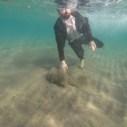 Man swimming in sea