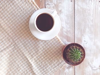 High angle view of coffee cup on table