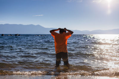 Mountain lake tween swims at sunset or sunrise - travel and adventure