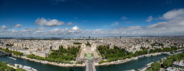 High angle view of buildings against cloudy sky