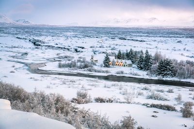 Scenic view of snow covered trees against sky