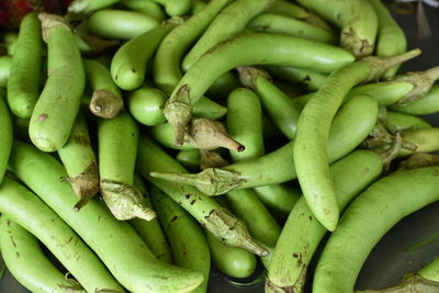 Close-up of green chili peppers for sale in market