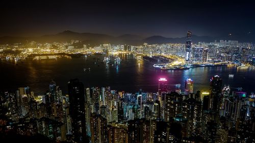 Aerial view of city lit up at night