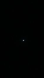 Illuminated moon against sky at night