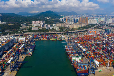 High angle view of commercial dock against sky in city