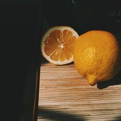 High angle view of oranges on cutting board