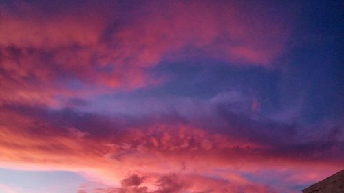 Low angle view of dramatic sky during sunset