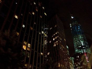 Low angle view of modern building at night