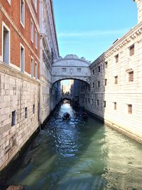 Arch bridge over canal in city