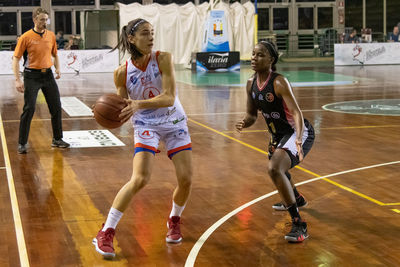 People playing basketball court