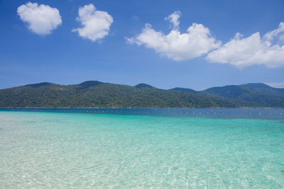 Scenic view of sea against blue sky