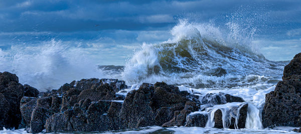 Panoramic view of sea against rocks