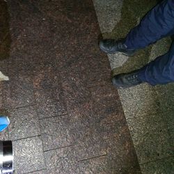 Low section of woman standing on tiled floor