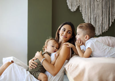 Portrait of mother and daughter at home