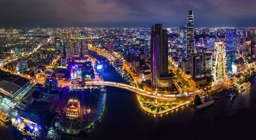 High angle view of illuminated city buildings at night