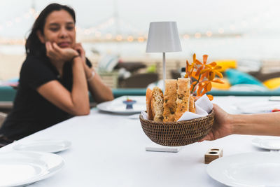 Portrait of young woman having breakfast