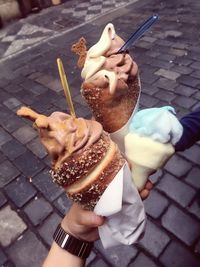 High angle view of hand holding ice cream