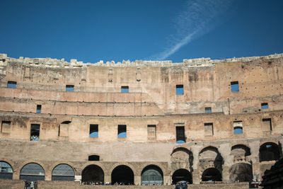 Low angle view of historical building against blue sky