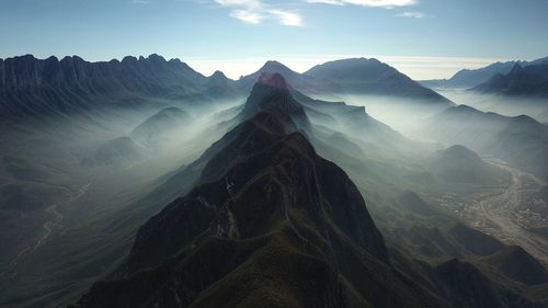 Scenic view of mountain ranges against sky