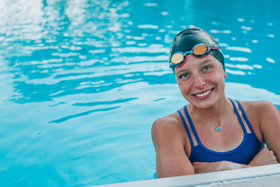 Portrait of woman swimming in pool