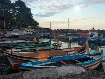 Boats moored at harbor