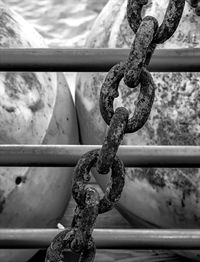 Close-up of rope tied up on metal