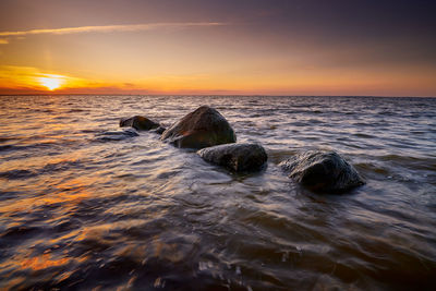 Scenic view of sea against sky during sunset