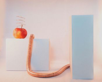 Close-up of open book on table against gray background