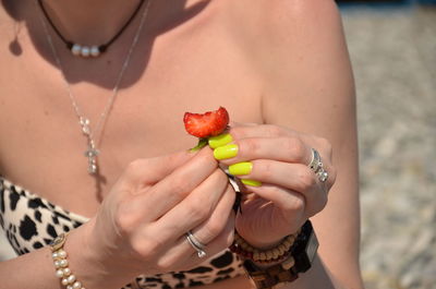 Midsection of woman holding ice cream
