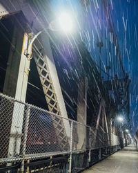 Low angle view of illuminated built structure at night