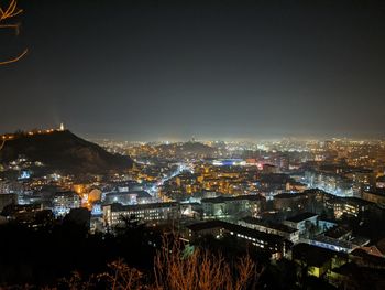 High angle view of illuminated buildings in city at night