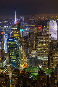 High angle view of illuminated buildings in city at night