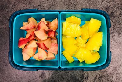 High angle view of fruits slices in bowl on table