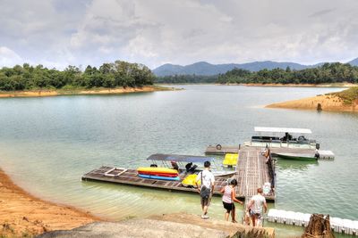 Panoramic view of boats in lake against sky
