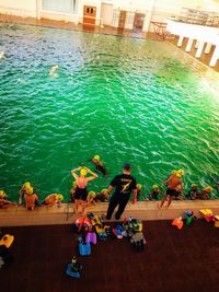 High angle view of people swimming in pool