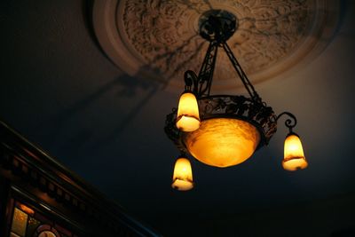 Low angle view of light bulbs hanging on ceiling