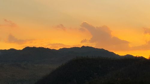 Scenic view of mountains at sunset